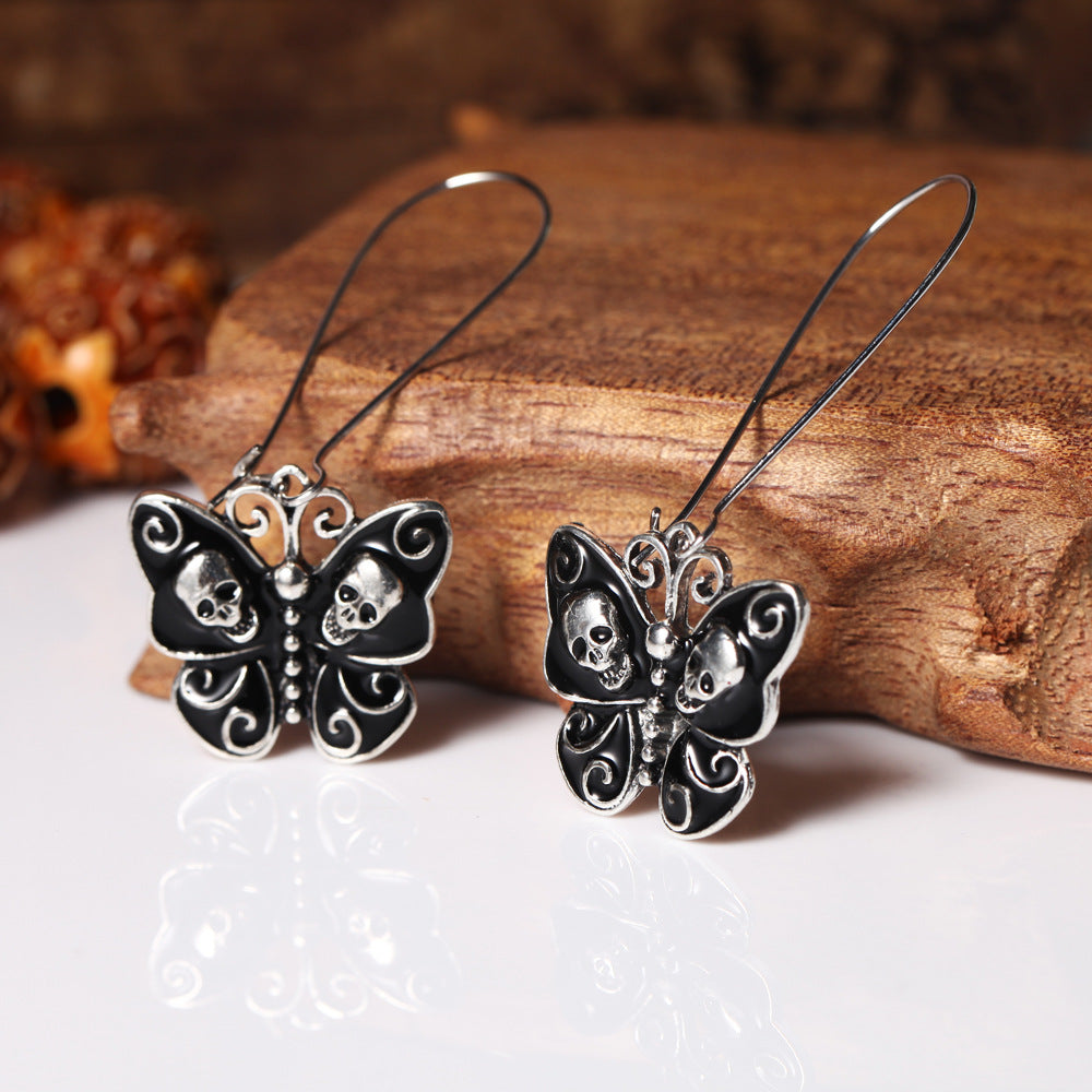 Butterfly skull earrings Angelwarriorfitness.com